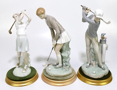 Lot 499 - LLADRO; a figure of a male and female golfer,...