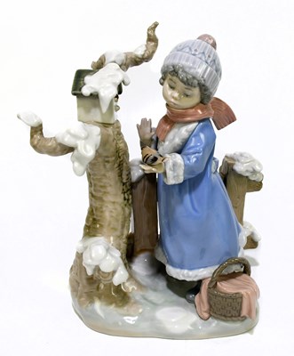 Lot 513 - LLADRO; a group of a girl and birds in a...