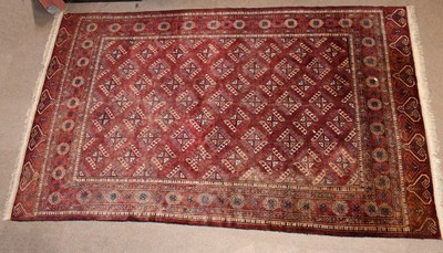 Lot 2663 - A Bokhara type handwoven wool rug, worked with...