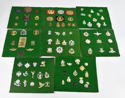 Lot 1265 - A large collection of military badges,...