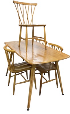 Lot 18 - ERCOL; a mid century light elm dining table...