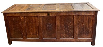 Lot 23 - An early 20th century oak coffer, the shield...