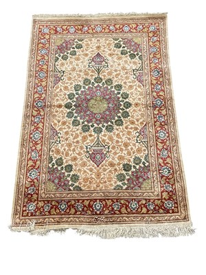 Lot 62 - A fine Persian silk cream ground Qum rug, the...