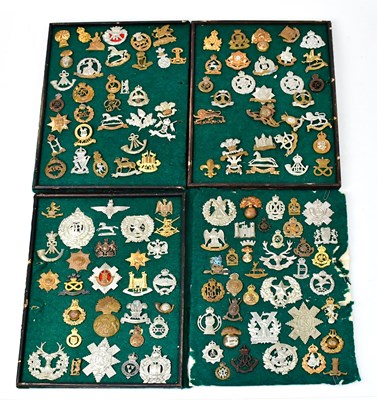 Lot 928 - A collection of regimental cap badges...