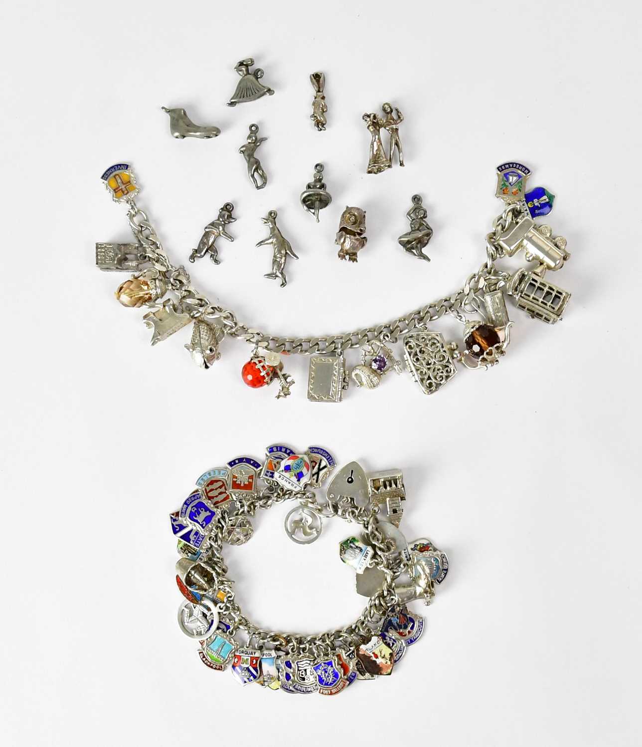Lot 1060 - A hallmarked silver bracelet set with various...