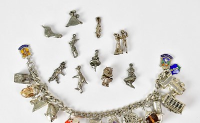 Lot 1060 - A hallmarked silver bracelet set with various...