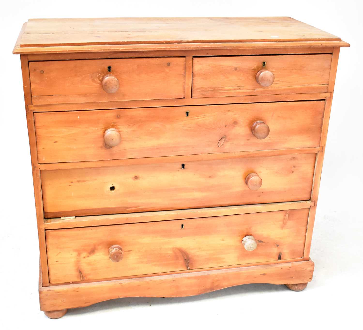 Lot 44 - A pine chest of two short over three long...