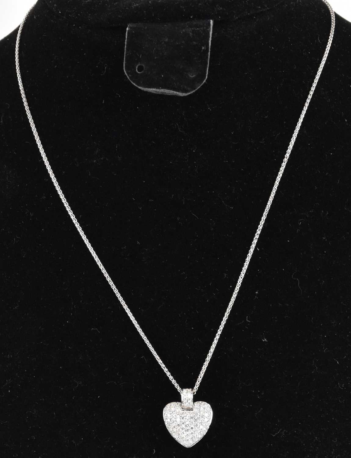 Lot 1200 - An 18ct white gold diamond chip heart shaped...