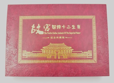 Lot 1569 - A cased set of twelve gold plated ingots to...