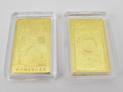 Lot 1569 - A cased set of twelve gold plated ingots to...
