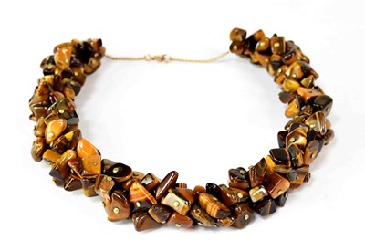 Lot 1086 - A necklace set with multiple tiger's-eye...