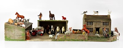 Lot 488 - A vintage toy farmyard, comprising cottage and...