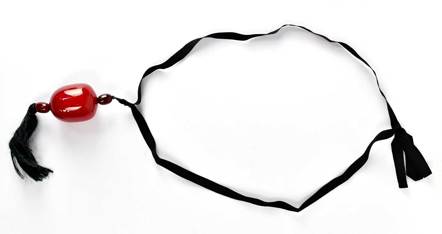 Lot A cherry large amber style pendant comprising...