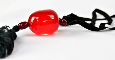 Lot A cherry large amber style pendant comprising...