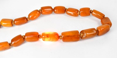 Lot 1092 - Two continuous amber-style necklaces, one with...