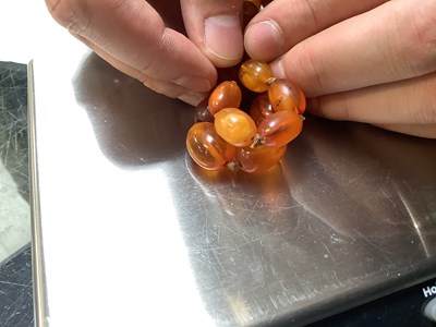 Lot 1092 - Two continuous amber-style necklaces, one with...