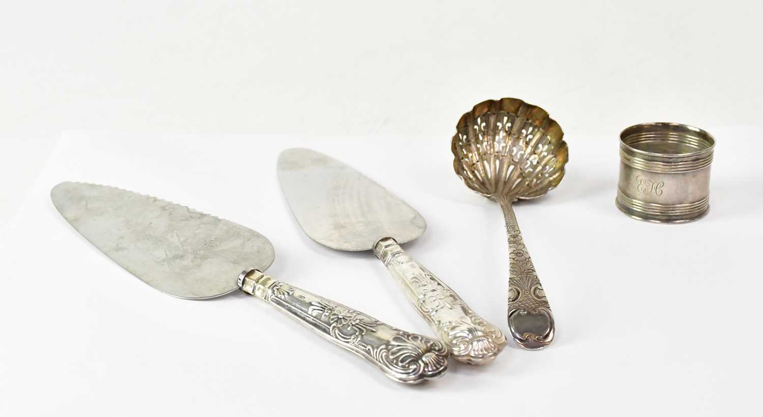 Lot 903 - A George III hallmarked silver pierced ladle...