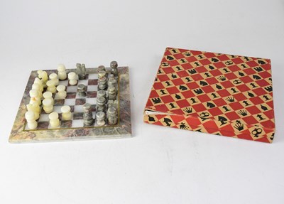 Lot 207 - A boxed hardstone chess set, board 25 x 25cm...