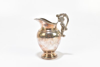 Lot 1102 - A 19th century Continental white metal jug
