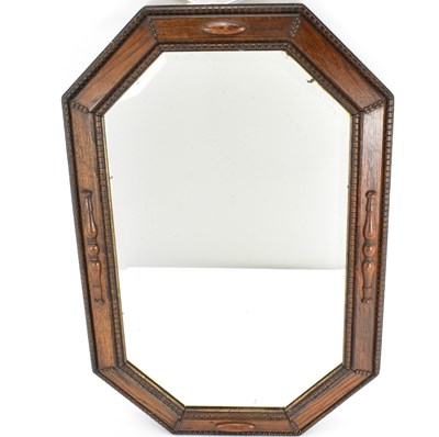 Lot 81 - An oak lozenge-shaped wall mirror inset with...