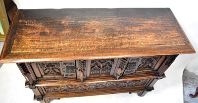 Lot 87 - A reproduction oak Dutch-style carved court...