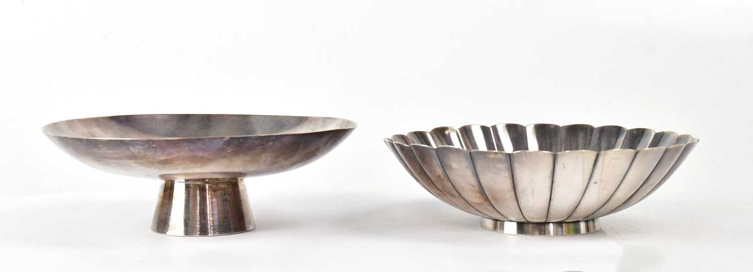 Lot 276 - Two Japanese silver sake dishes, one raised on...