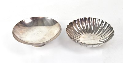 Lot 276 - Two Japanese silver sake dishes, one raised on...