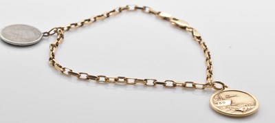 Lot 520 - A 9ct gold bracelet with gold St Christopher...