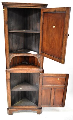 Lot 42 - A small reproduction oak corner cabinet in the...