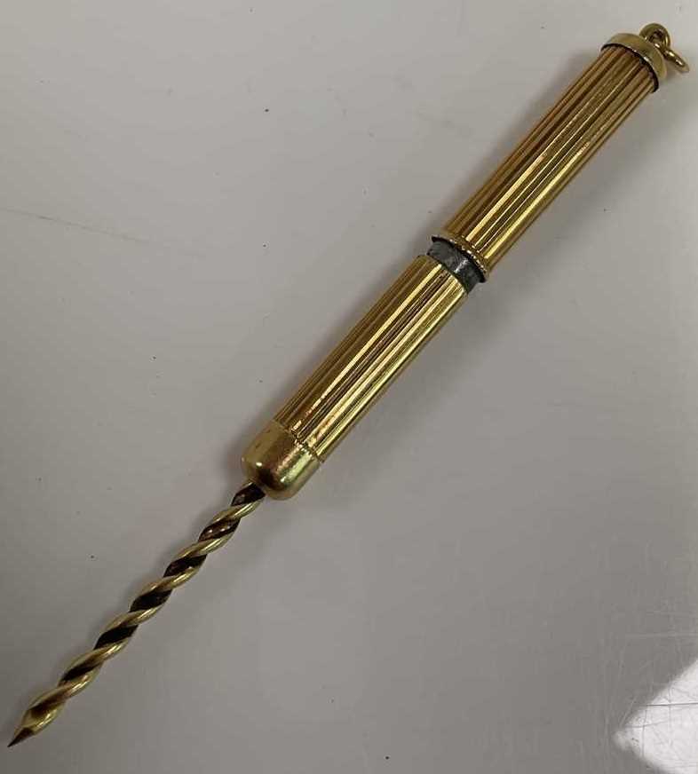 Lot 582 - An 18ct yellow gold cigar spike, with steel...