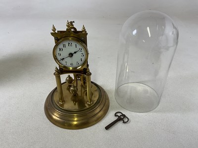 Lot 653 - A brass anniversary dome cased clock, height...