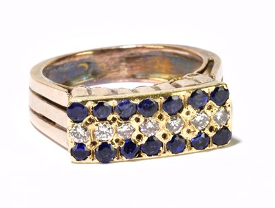 Lot 1117 - A yellow metal dress ring, set with slightly...