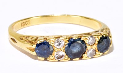 Lot 1118 - An 18ct yellow gold sapphire and diamond ring,...