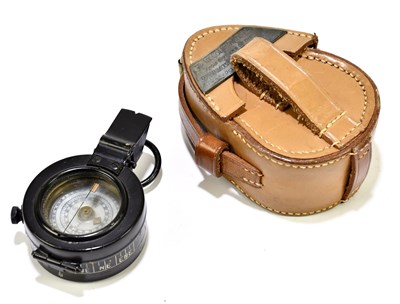 Lot 329 - A leather cased WWII compass, with applied...