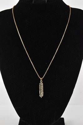 Lot 1416 - A 9ct gold Egyptian style necklace pendant,...
