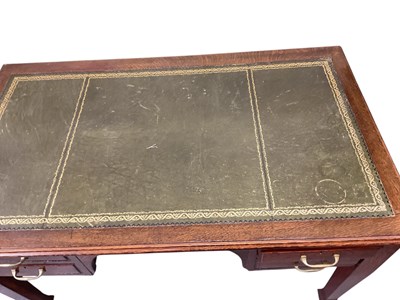 Lot 49 - An early to mid 20th century oak four drawer...