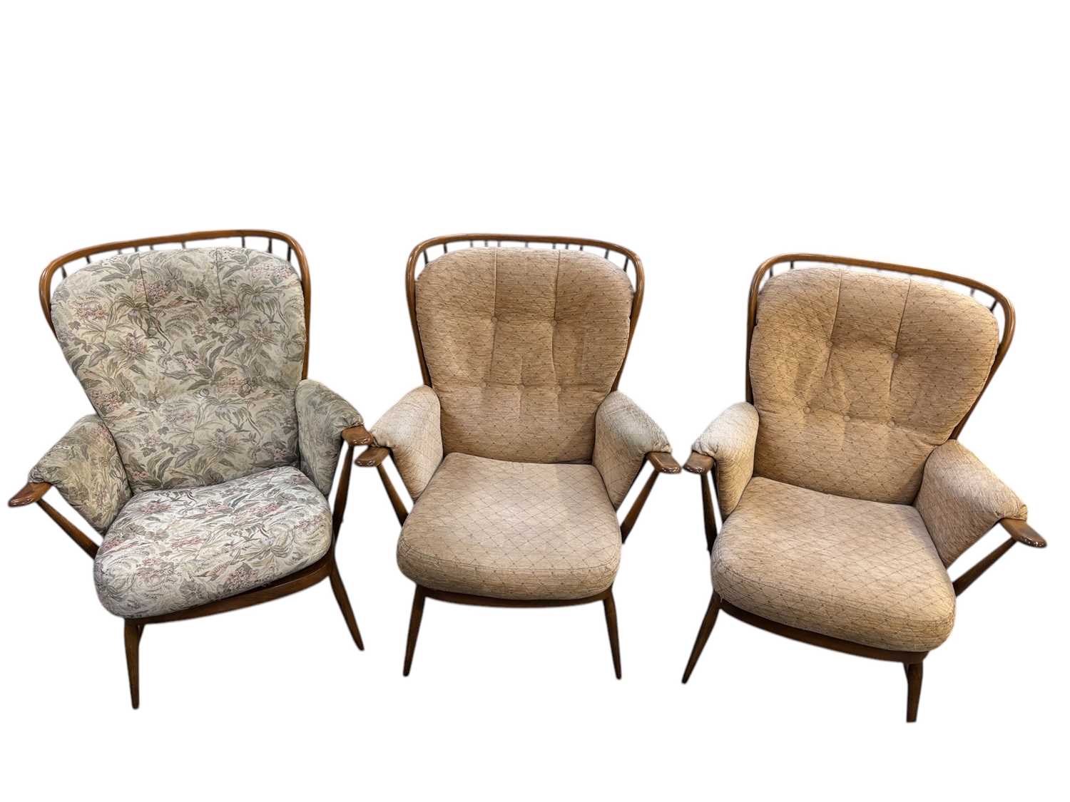 Lot 37 - ERCOL; a set of three medium elm spindle back...