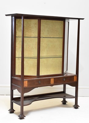 Lot 1016 - An Arts and Crafts inlaid mahogany display...