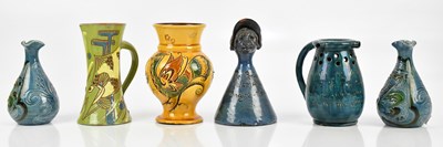 Lot 568 - C H BRANNAM; a pair of miniature bulbous vases...
