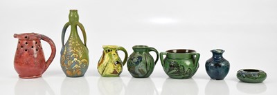Lot 569 - C H BRANNAM; a twin handled bottle vase,...