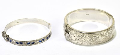 Lot 1284 - Two hallmarked silver hinged bangles,...