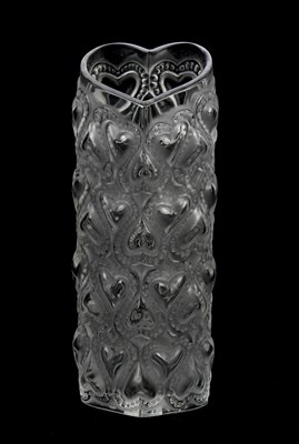 Lot 216 - LALIQUE; an 'Amour' vase, height 15cm, boxed...