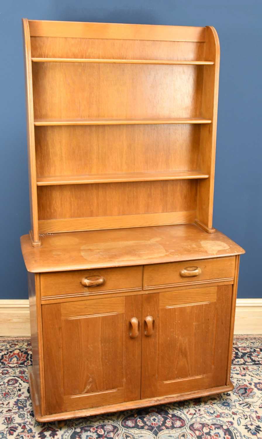 Lot 580 - An Ercol type light oak dresser, with three...