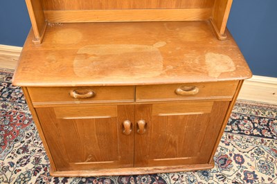 Lot 580 - An Ercol type light oak dresser, with three...