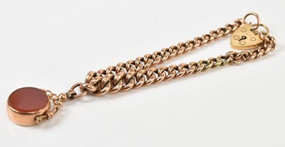 Lot 235 - A yellow metal curb link bracelet stamped '9C',...