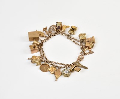 Lot 219 - A 9ct yellow gold curb link charm bracelet...