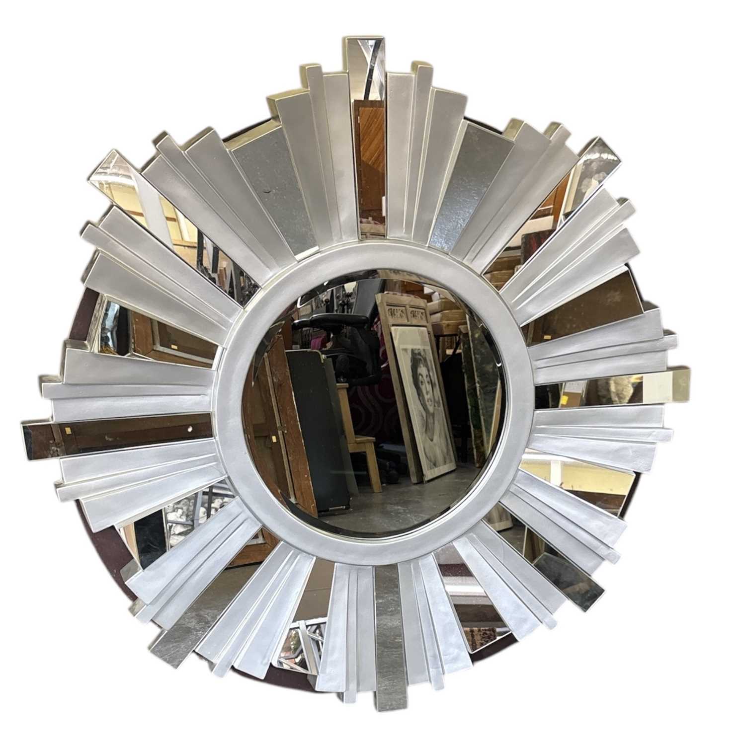 Lot 23 - A modern circular sunburst type wall mirror,...