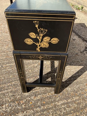 Lot 38 - A pair of modern Japanese black lacquer effect...