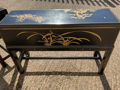 Lot 38 - A pair of modern Japanese black lacquer effect...