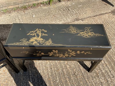 Lot 38 - A pair of modern Japanese black lacquer effect...
